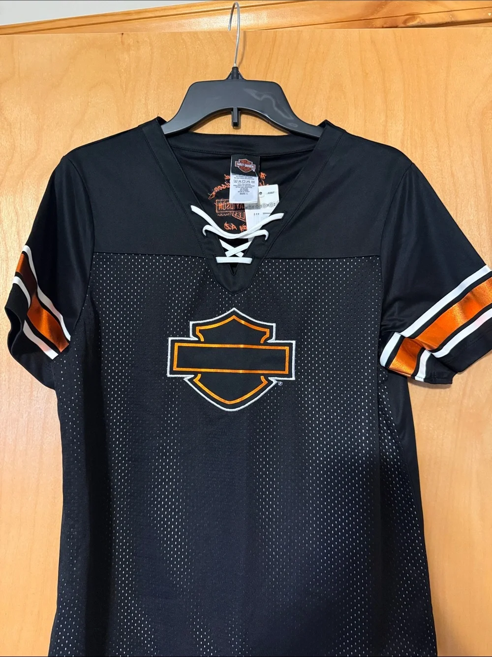 Harley-Davidson Black Jersey with Orange and White Sleeve Stripes from Peoria AZ